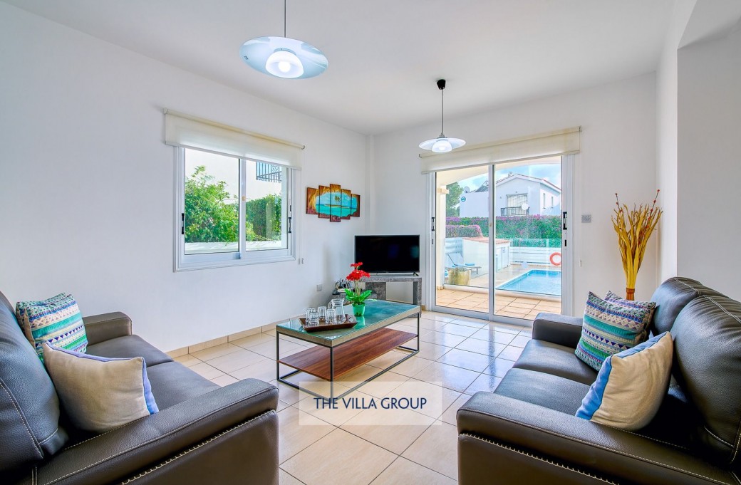 Living area with patio doors leading to the outside terrace