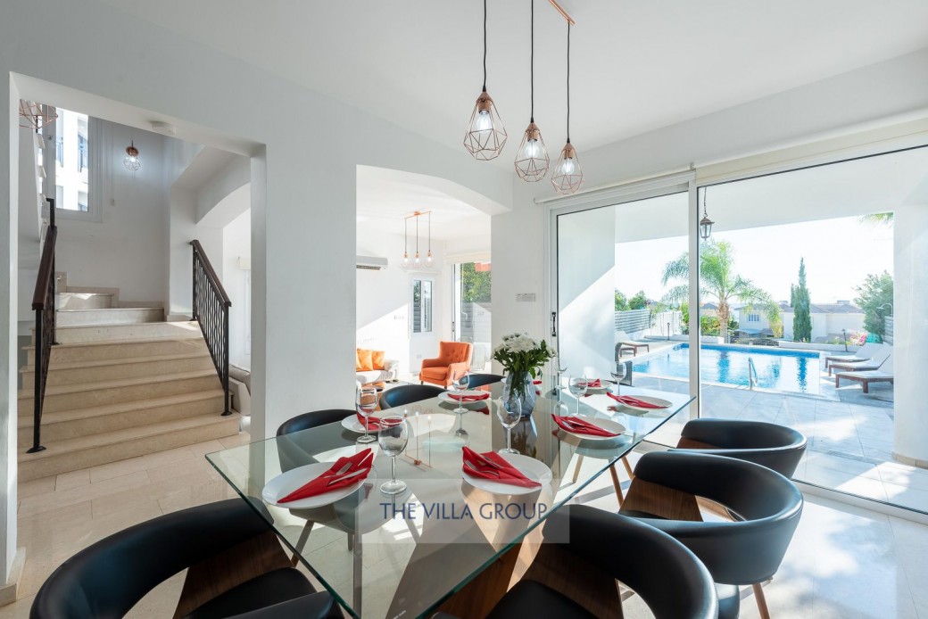 Patio doors lead to the outside furnished area