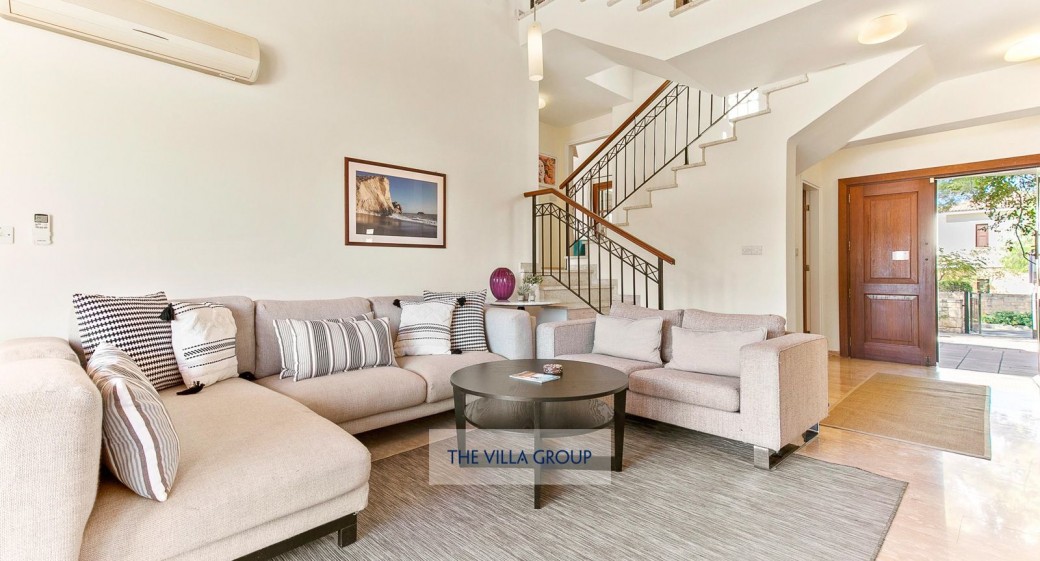 Large open plan living and dining area with a vaulted ceiling