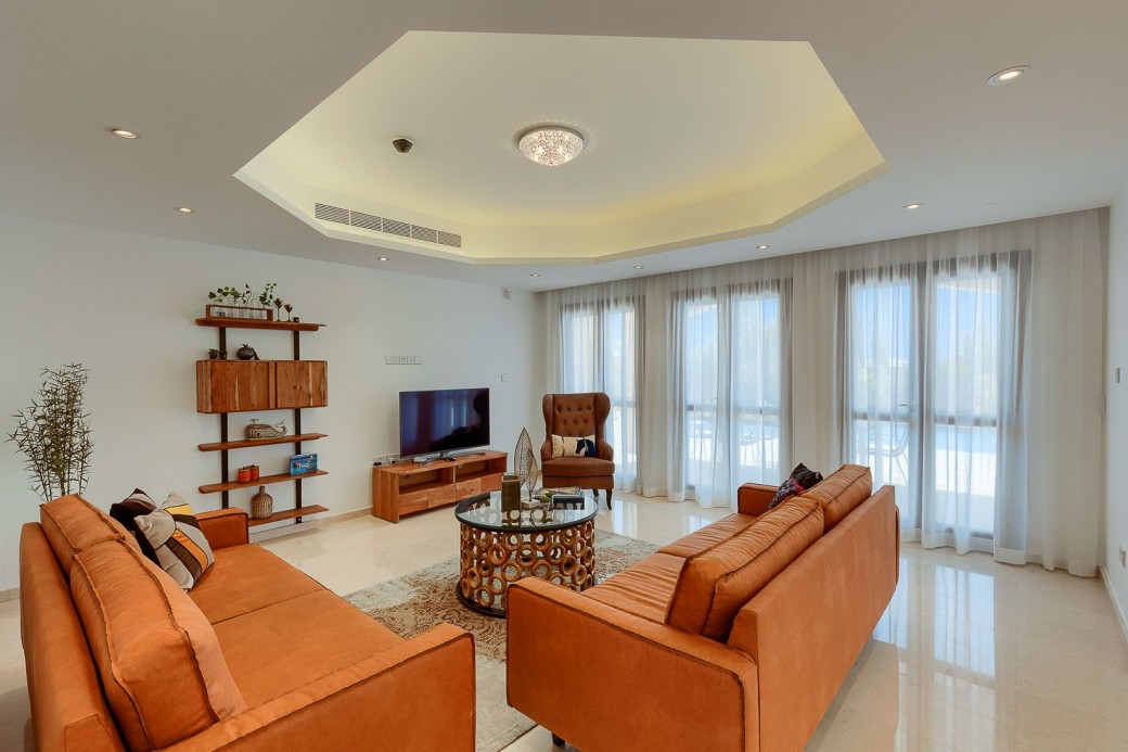 Doors from the living area lead to the furnished terrace and swimming pool