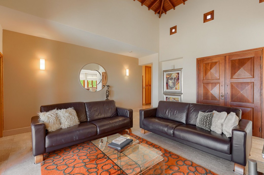 The room boasts two 3 seater leather sofas