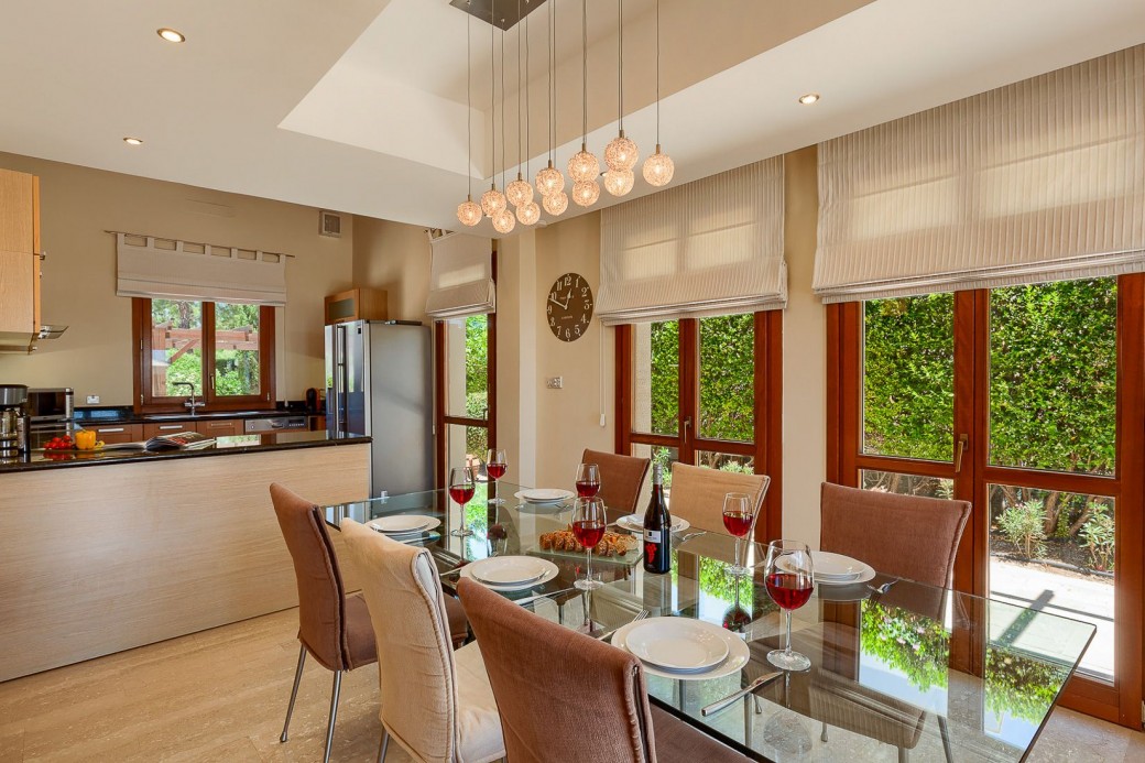 Grand square dining table with glass top and six dining chairs - ideal for entertaining