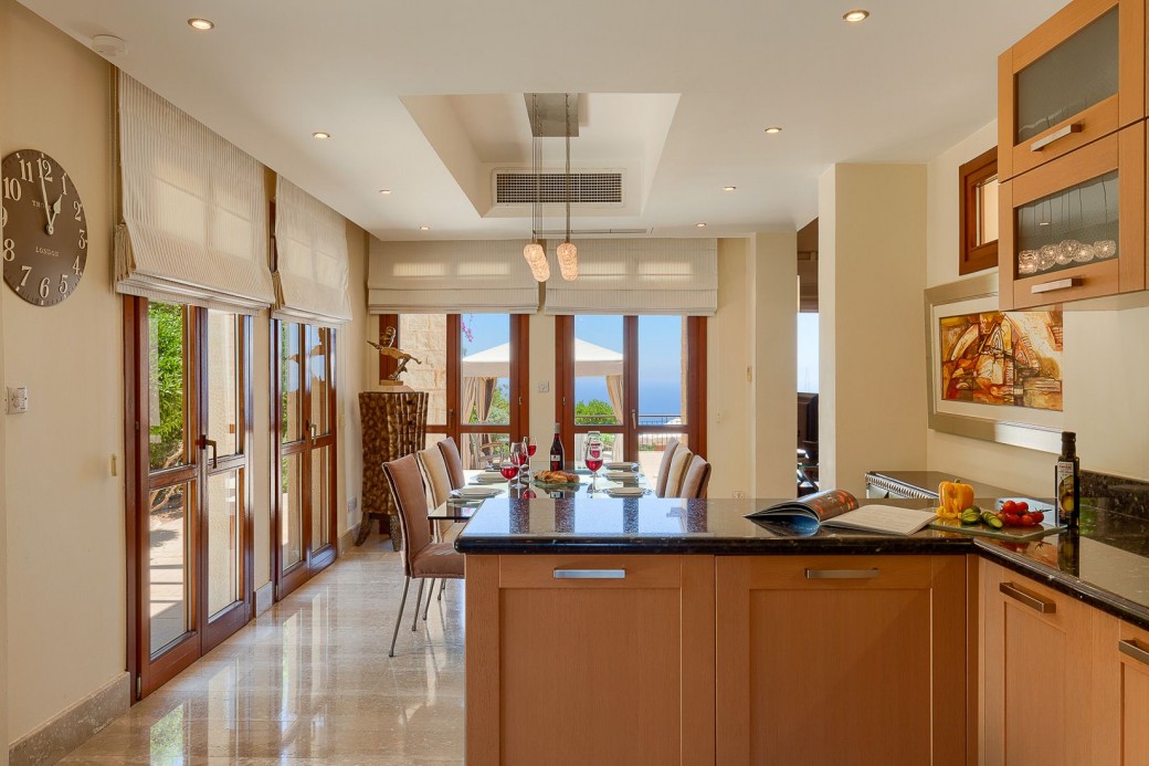 The contemporary kitchen is designed in Italian wood and offers all modern-day appliances