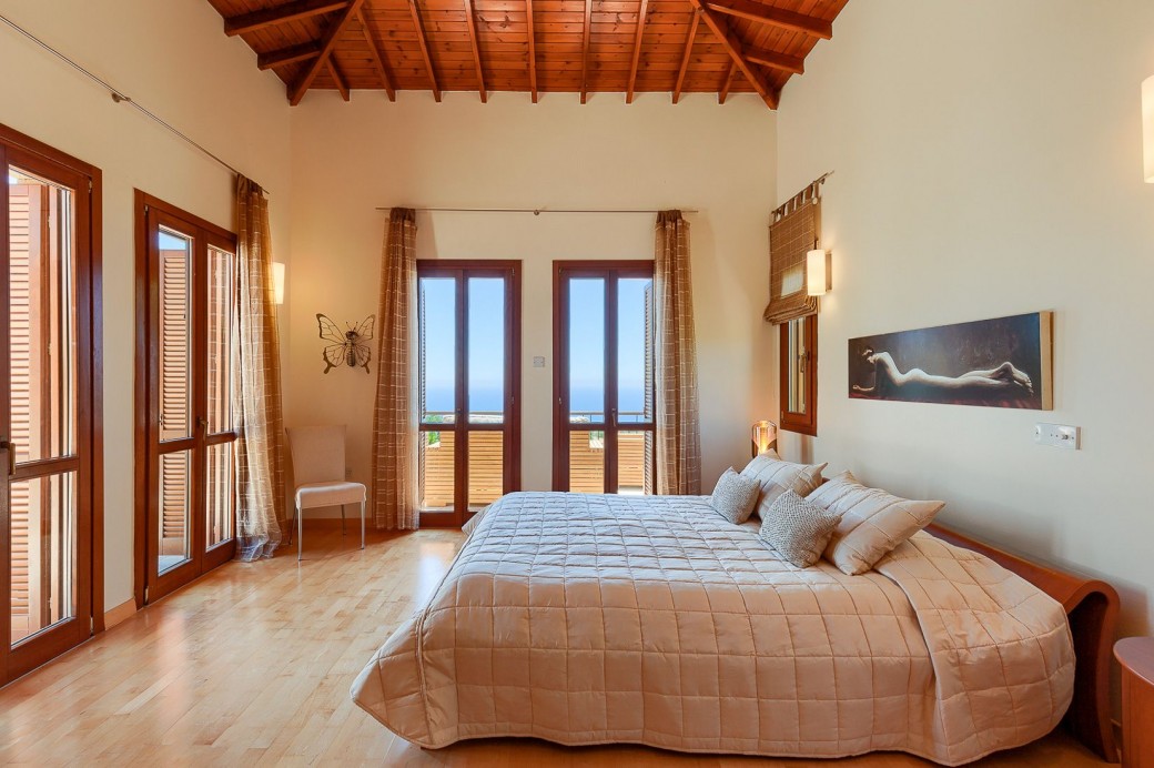French doors leading to the pool and patio area