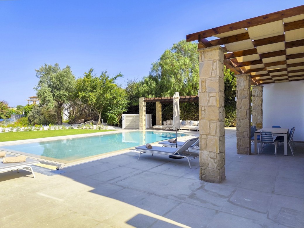 Step outside to discover a beautifully minimalistic garden with manicured grass
