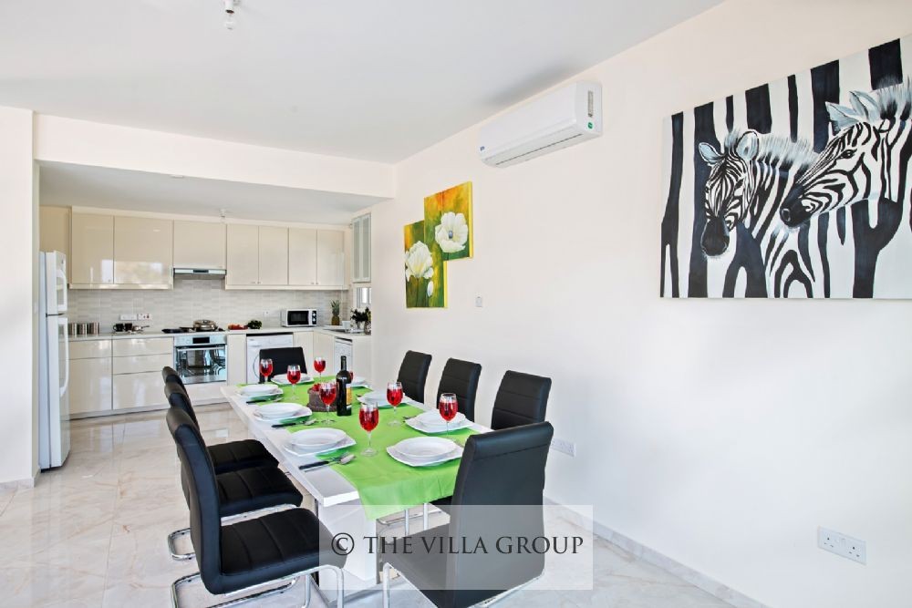 Kitchen and dining area seating 8 guests 