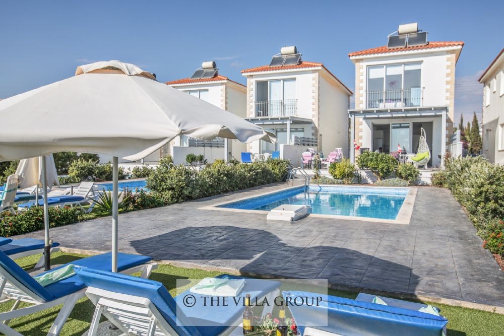 Sun loungers in front of the swimming pool