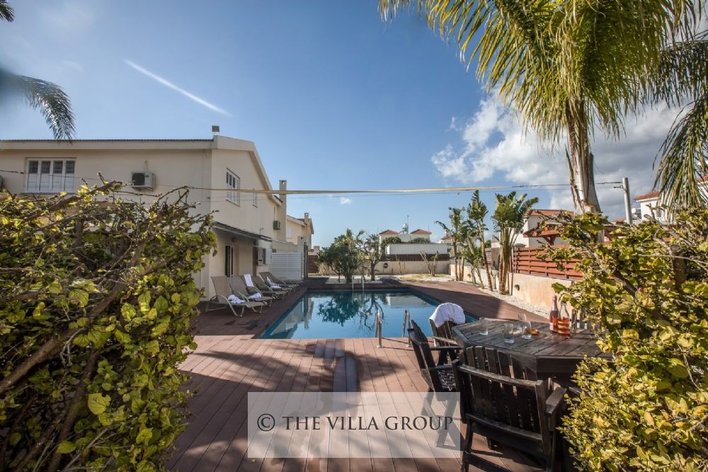 The villa is surrounded by established greenery