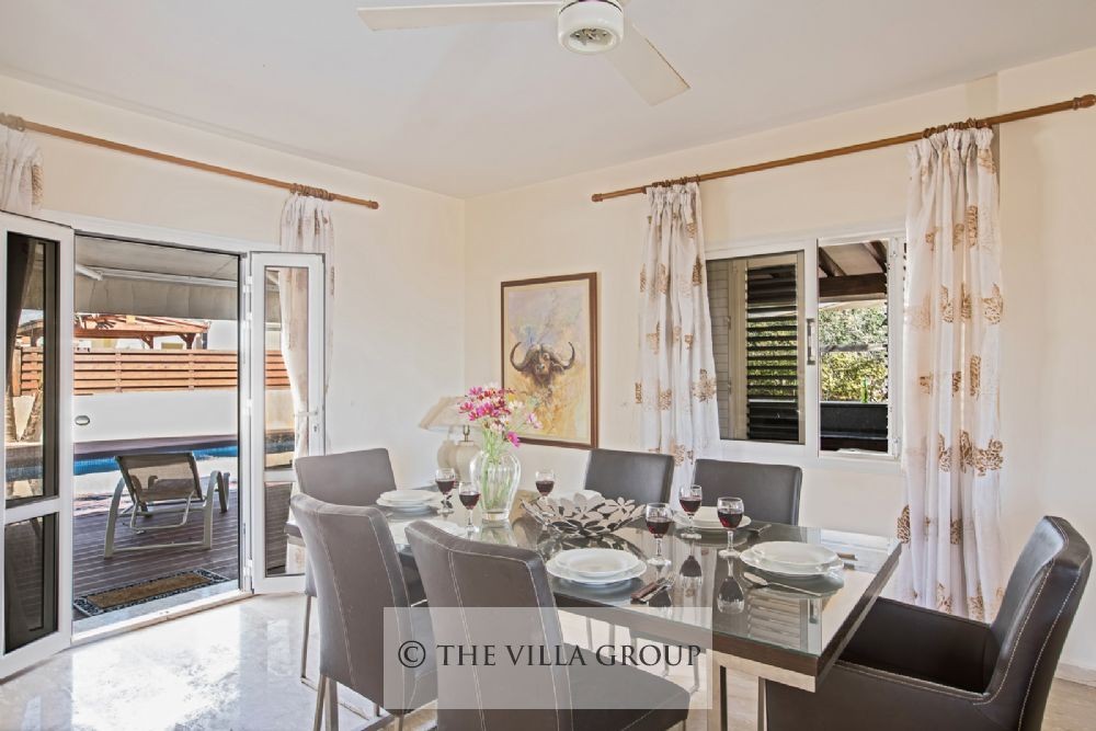 Dining area with patio doors leading to the outside terrace