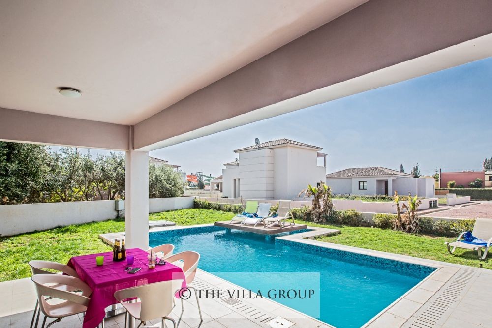 Covered terrace area with patio table