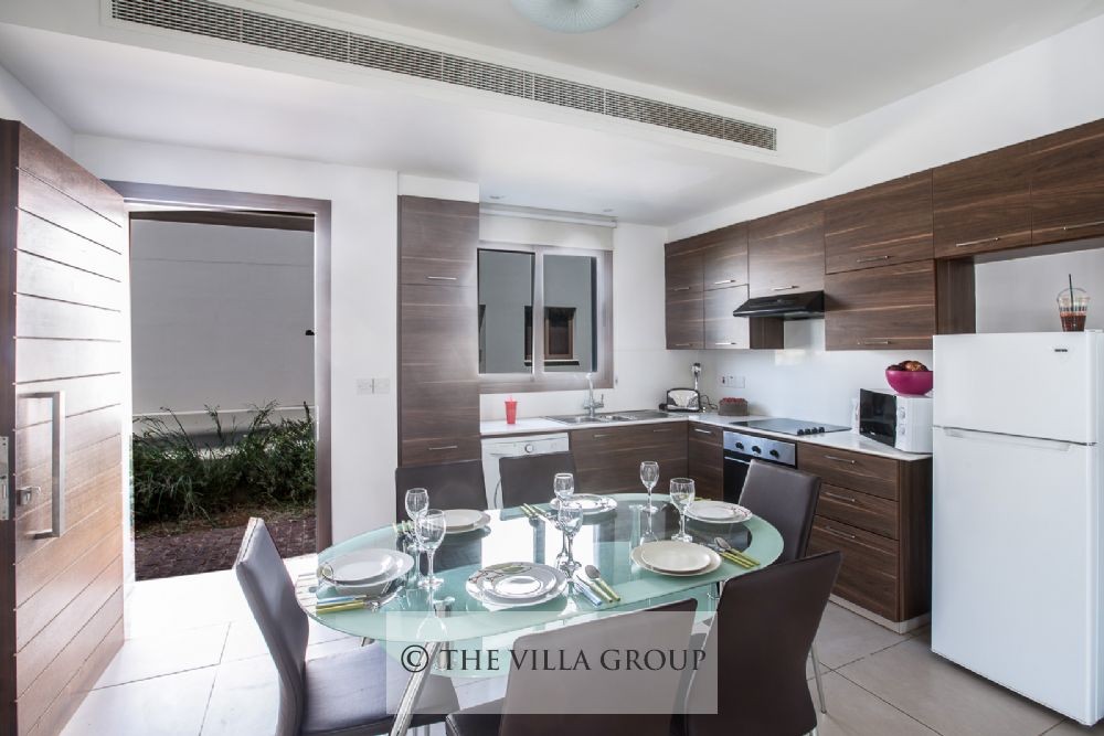 Villa entrance with kitchen and dining area