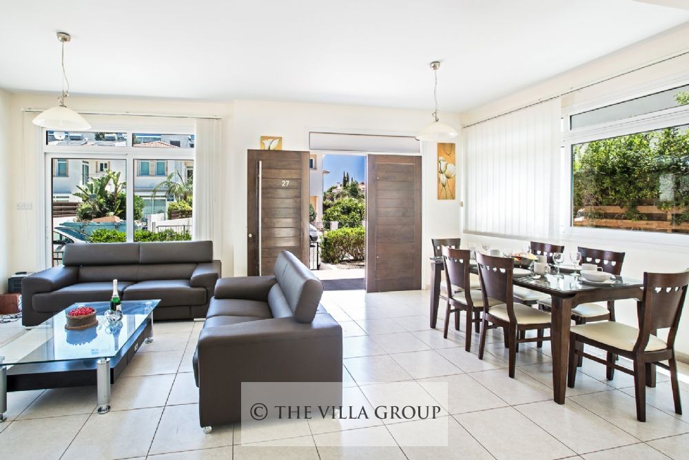 Living and dining area with entrance door