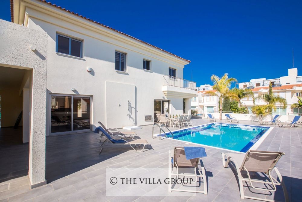 Swimming pool surrounded by sun loungers