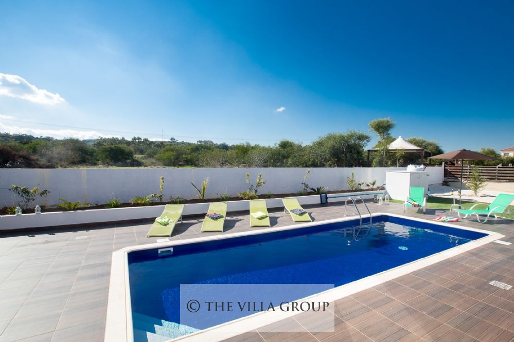 8x3 m swimming pool surrounded by sun loungers