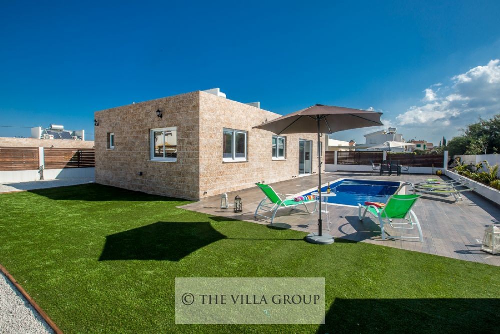 Patch of artificial lawn next to the swimming pool area