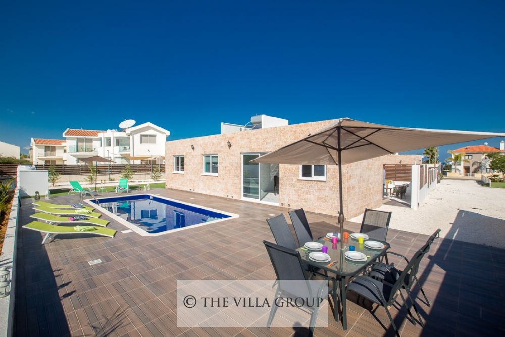 Furnished swimming pool area with a wooden deck