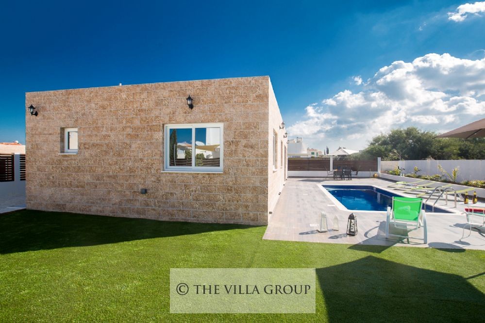 Spacious lawned area on the side of the villa