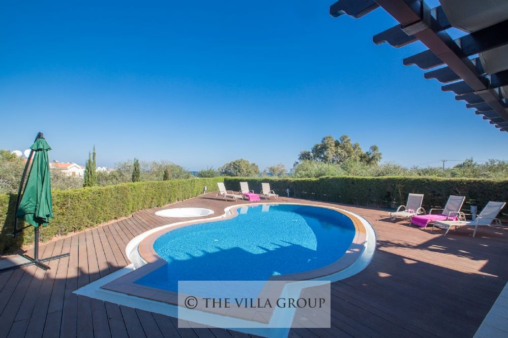 Private swimming pool surrounded by a wooden deck