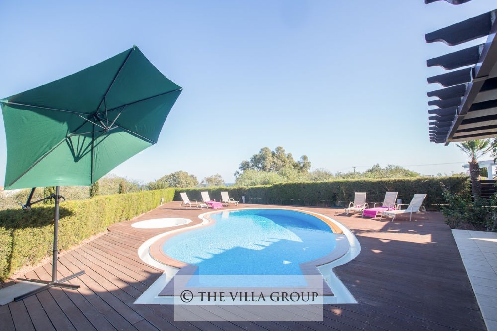 Swimming pool with a wooden deck