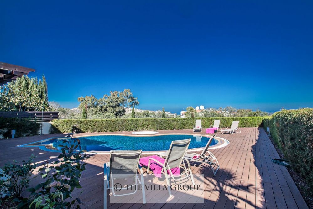 Sun loungers surrounding the swimming pool