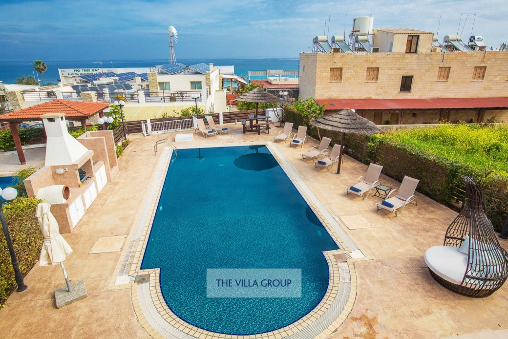 Sunbeds and outside furniture set the scene for relaxing on holiday