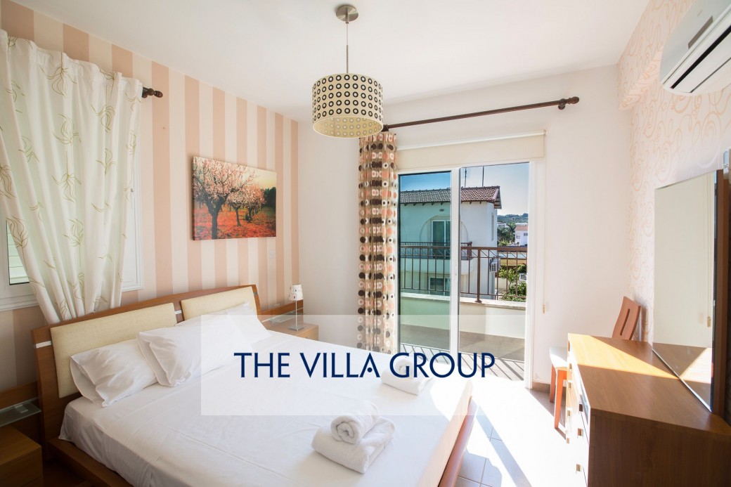 Both bedrooms have direct access to the shared balcony at the front of the villa
