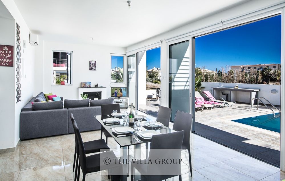 Dining and living area opening to the swimming pool area