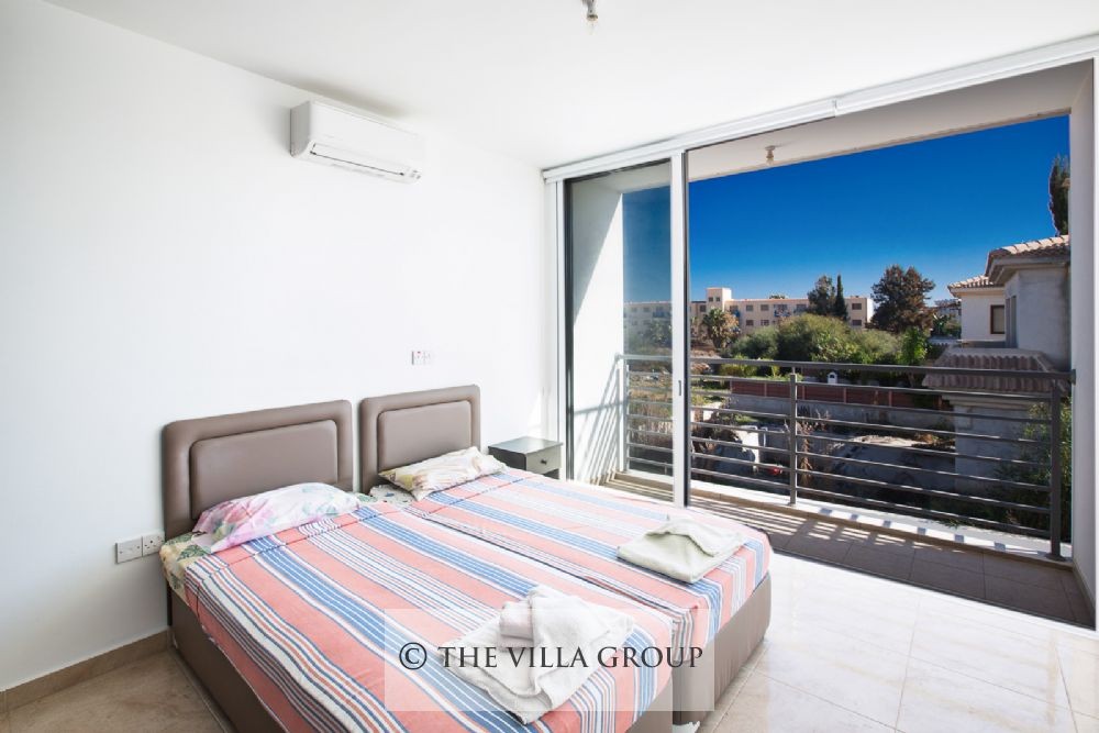 Second bedroom with twin beds and balcony