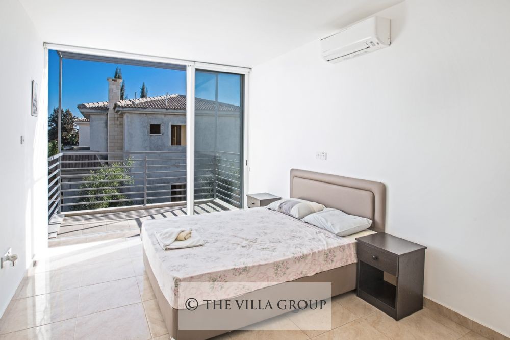 Main bedroom with twin beds and balcony