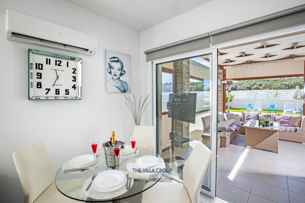 Patio doors from the living area lead to the outside terrace