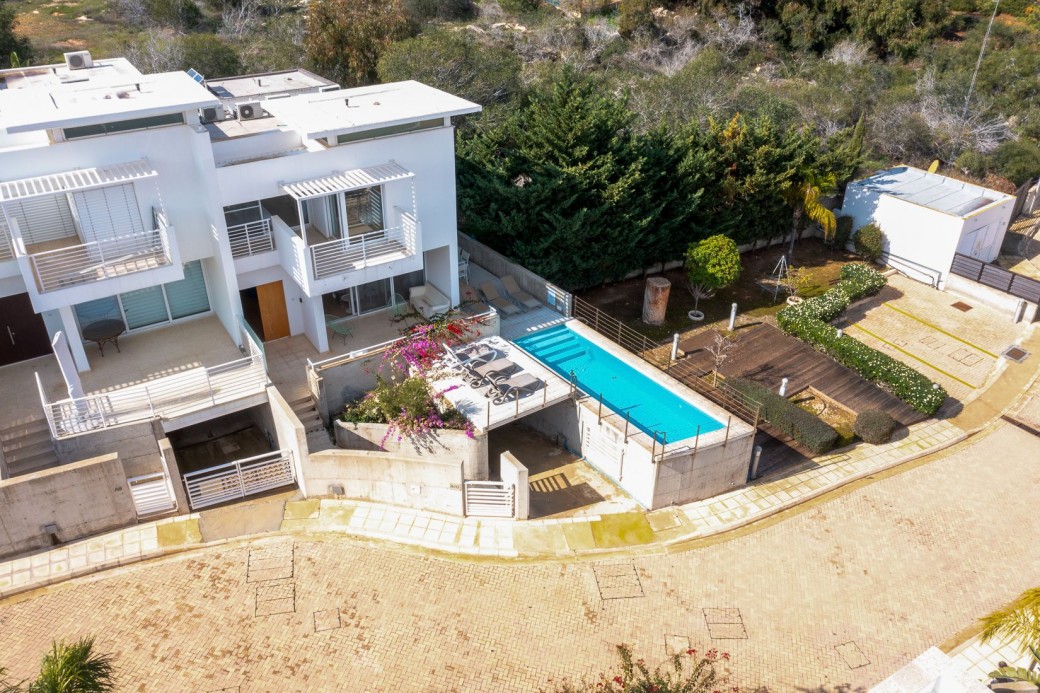 Adjacent to the villa is a lush green space and a small park