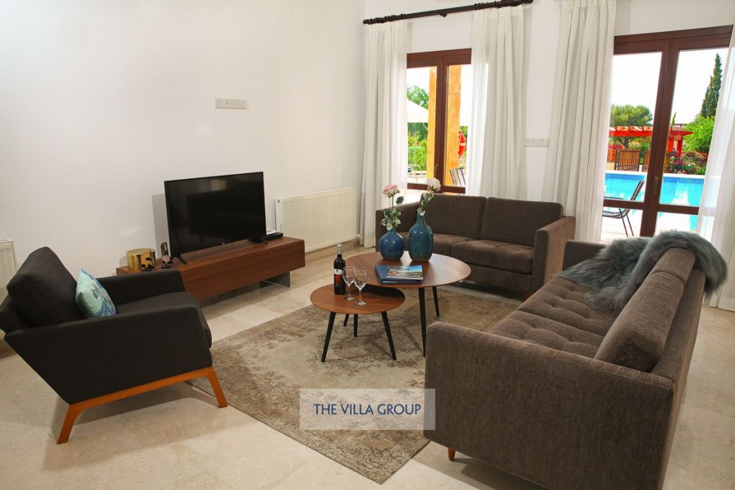 Living area with comfortable sofas, TV and DVD player
