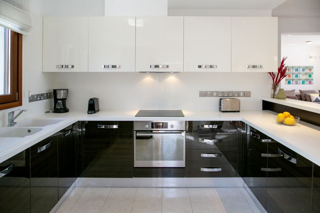 The kitchen equipped with top-of-the-line Italian units and a full range of modern appliances