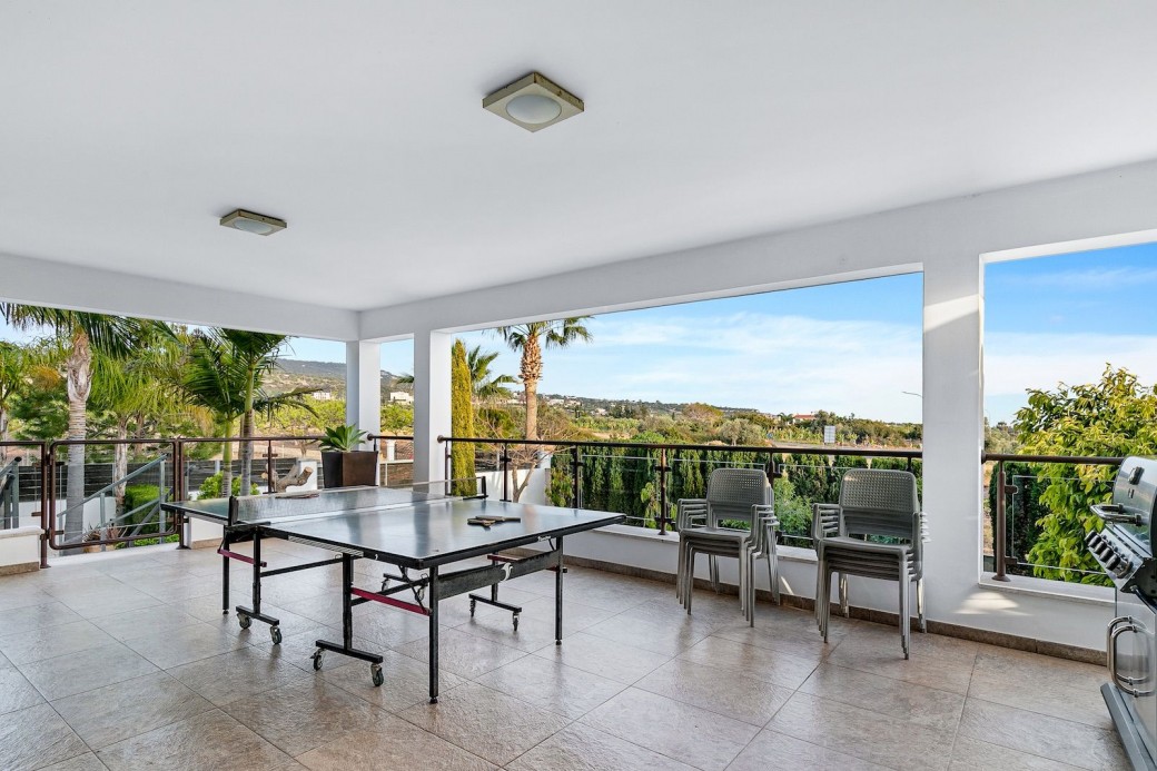 Terrace adjacent to the kitchen with table tennis