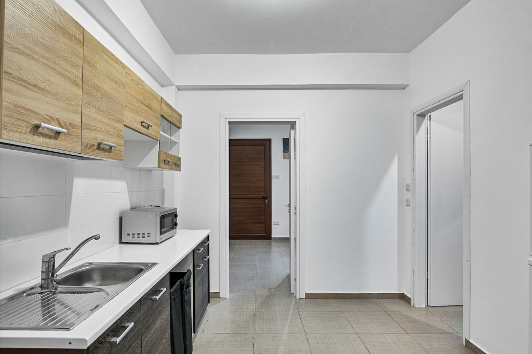 Kitchen separates the two bedrooms on the lower ground floor