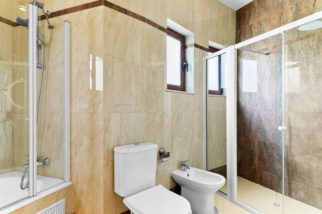 Family bathroom with tub and walk-in shower on the first floor