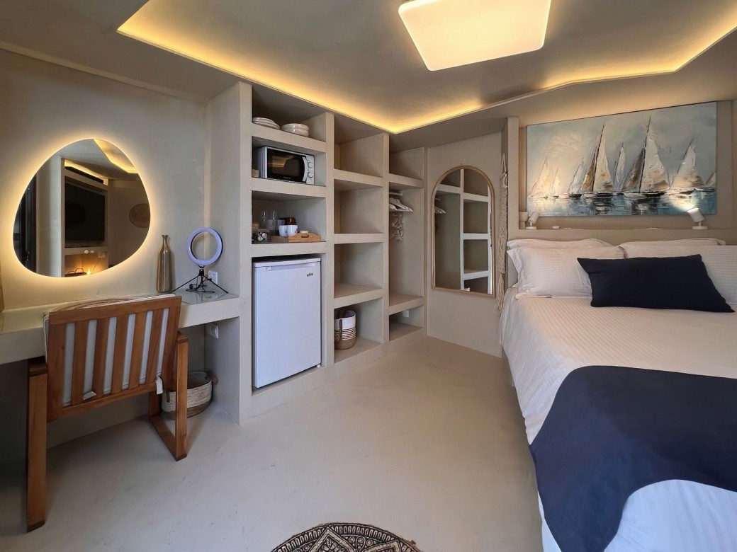 The 5th bedroom of the villa is the garden room with a double bed