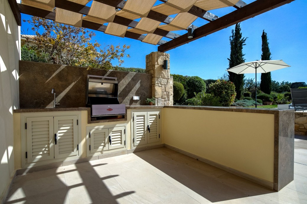 Built-in BBQ area with gas BBQ and outdoor food preparation space